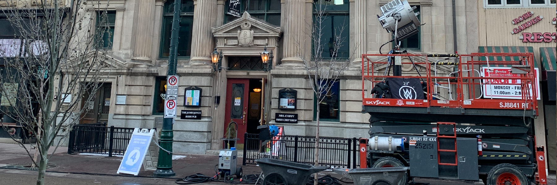 Filming equipment in front of historic calgary building